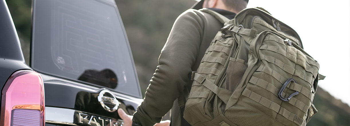 Man wearing bug out bag