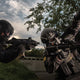 Two SWAT members wearing the Tactical Air-Purifying Respirator mask (TAPR)