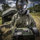 Solider testing air samples while wearing the CM-7M nuclear gas mask