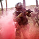Soldier going through dense smoke while wearing the CM-7M military grade gas mask