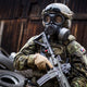 Soldier with full military wearing wearing the CM-7M NATO gas mask