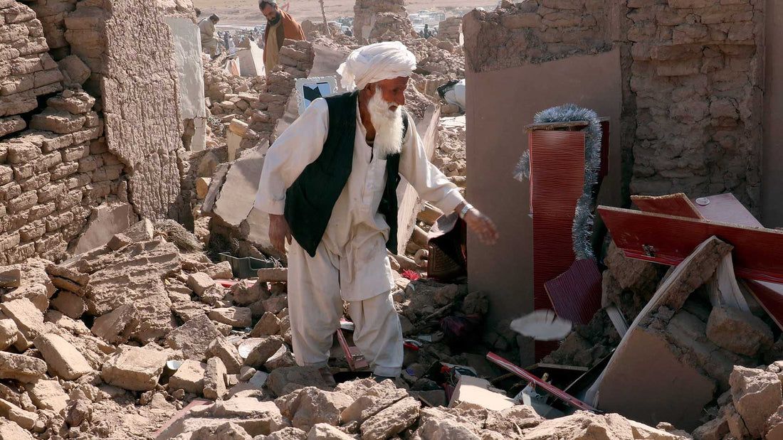 Old man in the debris of earthquake