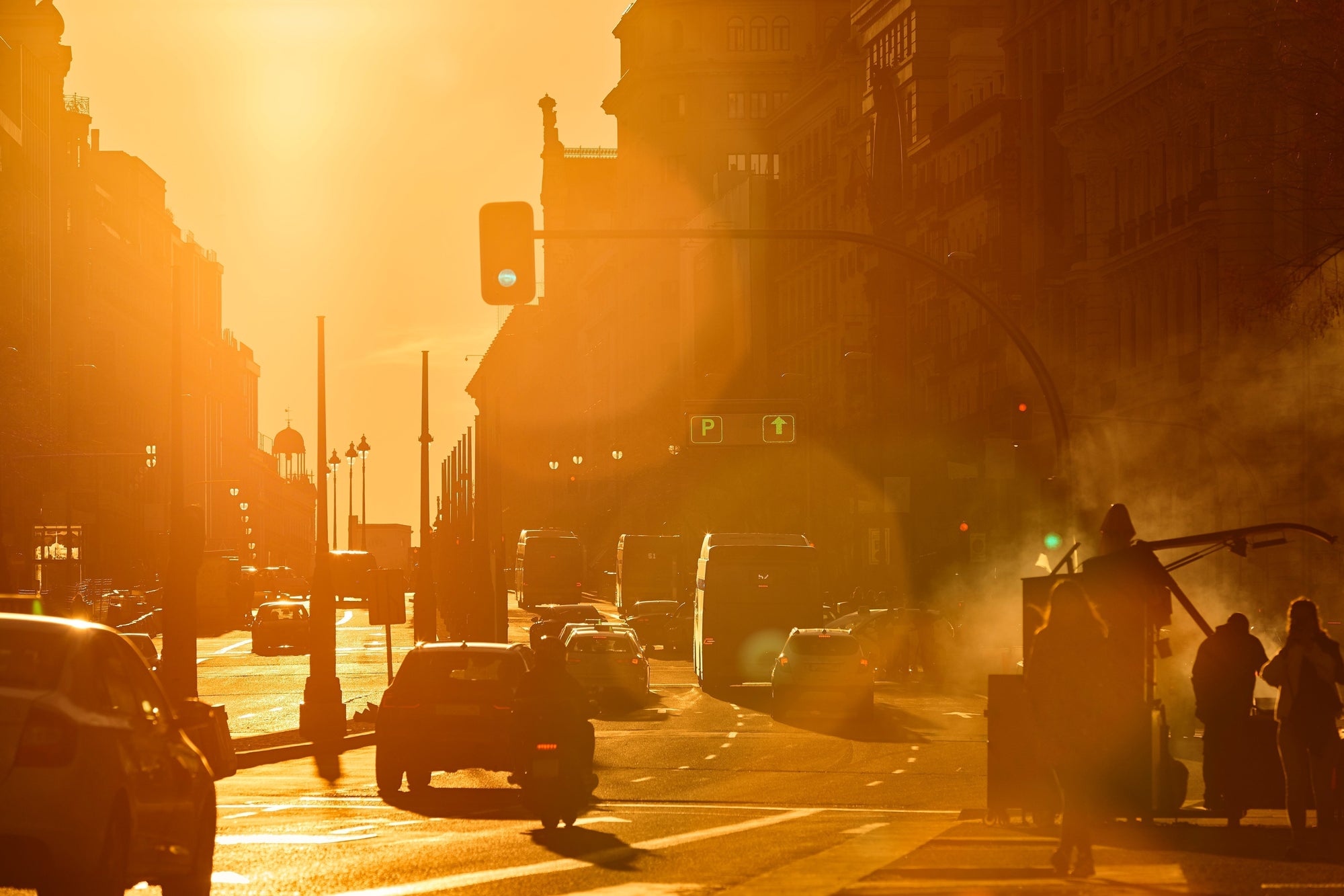 Urban street scene showing civilians navigating smoke during civil unrest