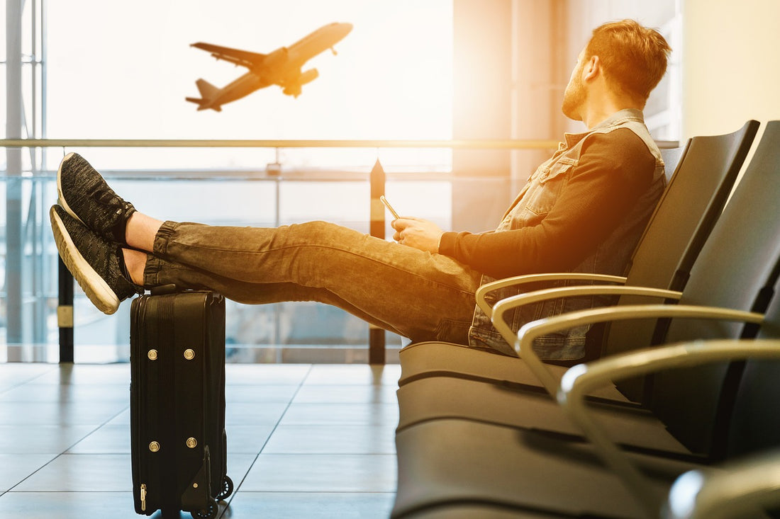 man reclining in airport lounge area