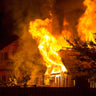 Raging Fire Consumes Building During Dark Night