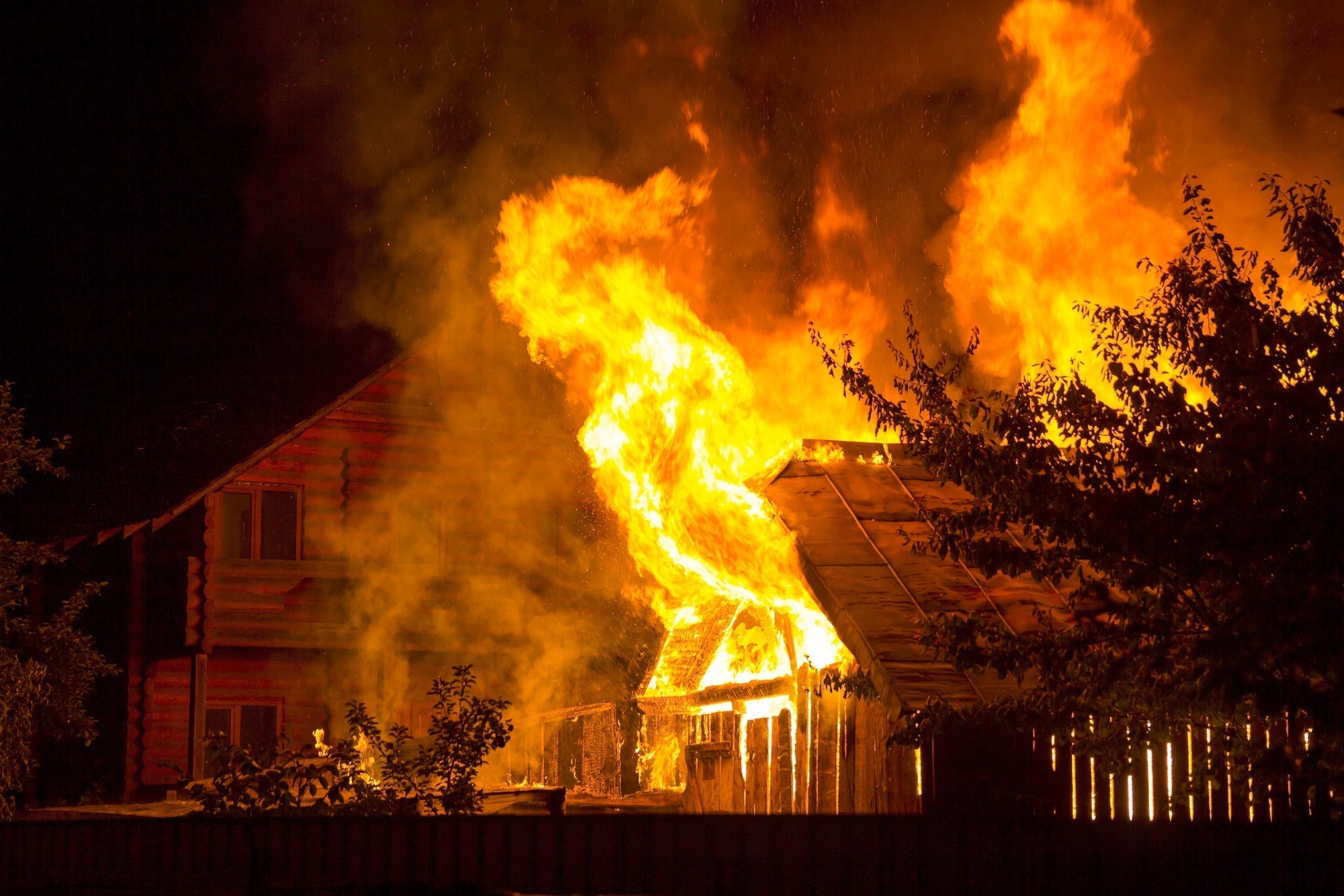 Raging Fire Consumes Building During Dark Night
