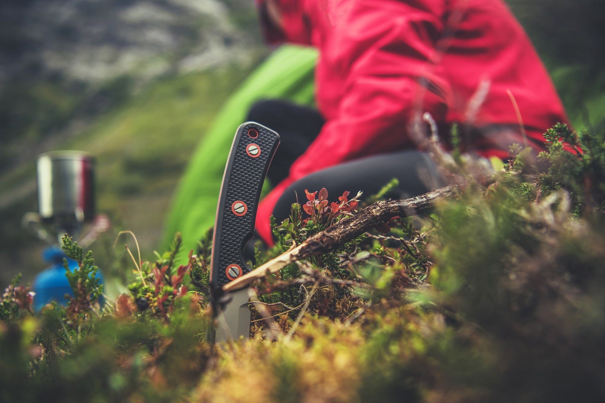 Person camping in a wilderness survival situation