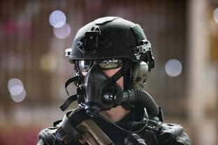 an operator wearing an air purifying respirator