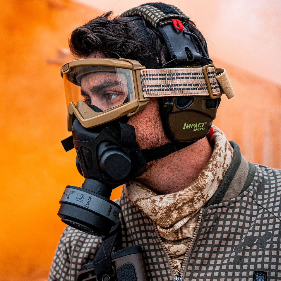 3/4 medium profile shot of a man wearing the TAPR mask, with a center port configuration for the filter.