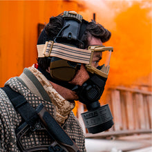 Side profile view of a man wearing a TAPR mask attached with a NBC-17 filter