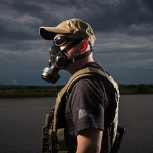 Side profile of an officer wearing a TAPR half face mask with the P-CAN compact filter.
