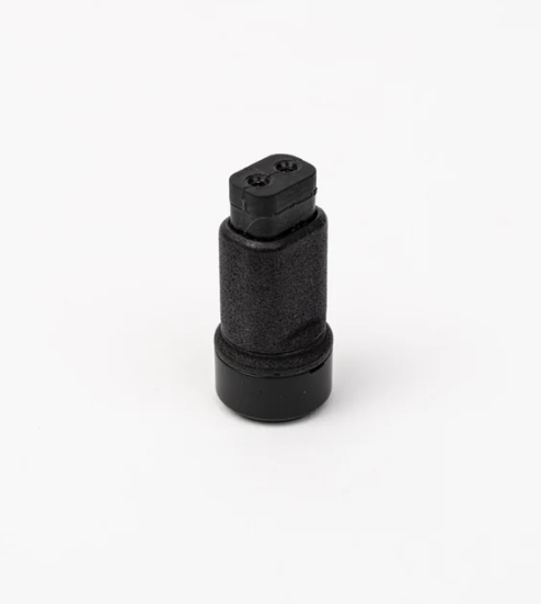 Black cylindrical object with a hexagonal head on a white background