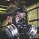 Side view of a man wearing the CM-6M tactical gas mask