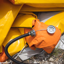 A close up shot of the decontamination shower's nozzles and valve systems, while deflated.