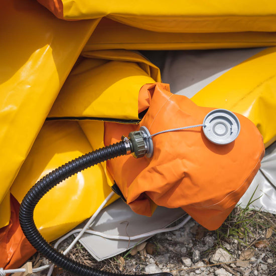 A close up shot of the decontamination shower's nozzles and valve systems, while deflated.