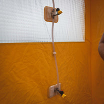 3/4 view of the decontamination shower's valve and tubes, these direct the path of the cleansing solution and water.