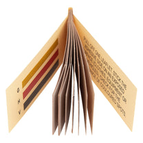 Folded leaflet with text and color swatches on a white background