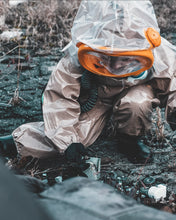 Kid picking up rubble while wearing the CM-3M Child Escape Respirator