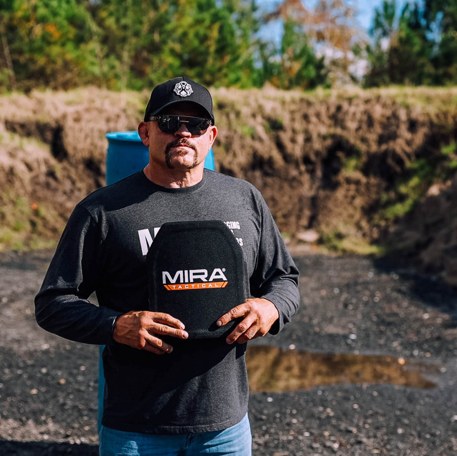 Chuck Liddell holding the MIRA Tactical level 4 body armor plate
