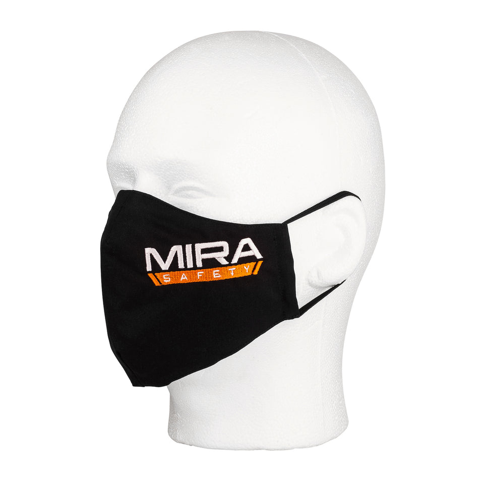 Three quarter view of the MIRA Safety Mask with the classic logo on a mannequin head