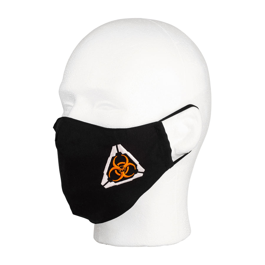 Three quarter view of the MIRA Safety Mask with biohazard insignia on a mannequin head