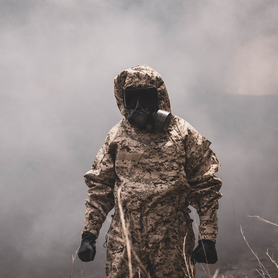 Man wearing MIRA Safety MOPP Suit and CM-8M Full-Face Respirator.