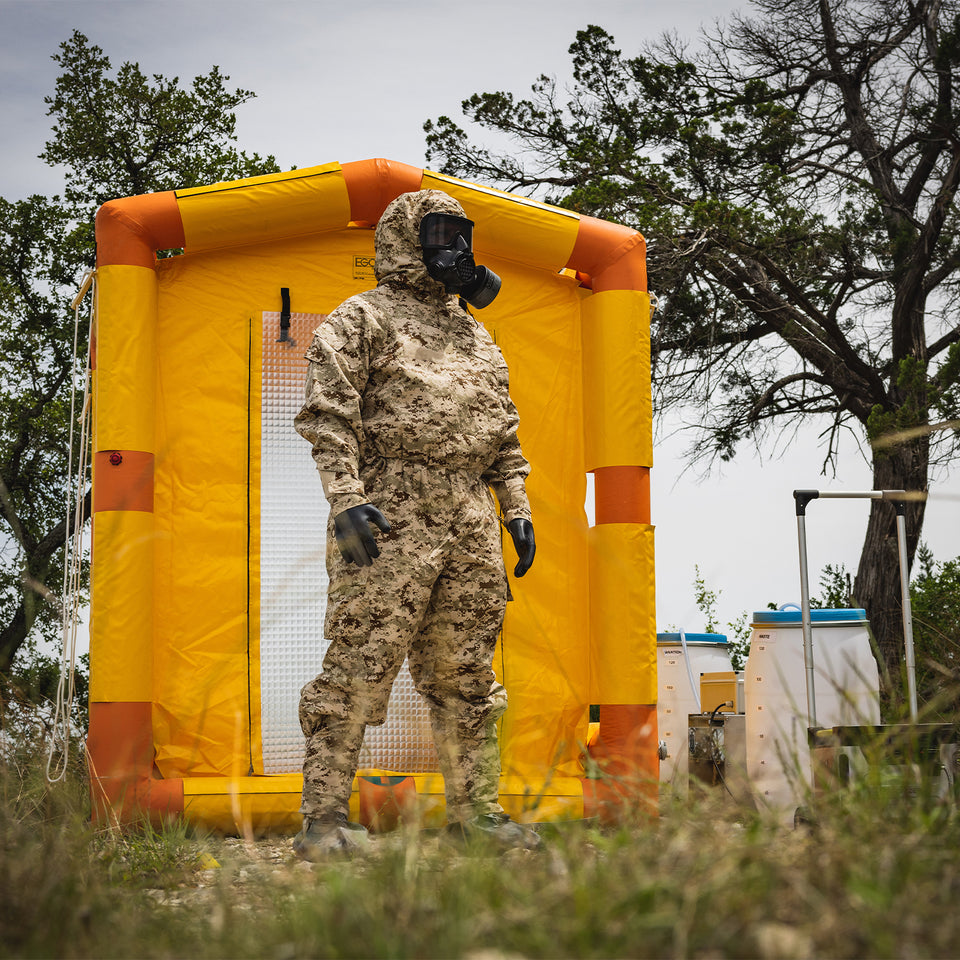 Man wearing MIRA Safety MOPP Suit and CM-8M Full-Face Respirator.