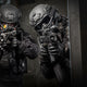 Two SWAT members breaching a door while wearing the Tactical Air-Purifying Respirator mask (TAPR)