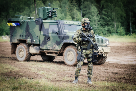 Military man with the NBC-77 SOF CBRN gas mask filter