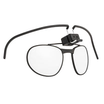 A black spectacle kit designed for military gas masks, featuring a frame with a clip-on attachment for lenses.