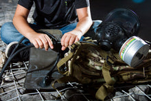 Child connecting the drinking system of the CM-6M tactical gas mask
