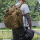 Man wearing a backpack, along with the MIRA Safety Nuclear Survival Kit