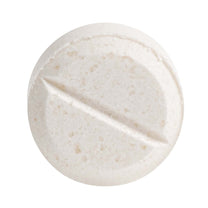 Close up shot of a single potassium iodide tablet