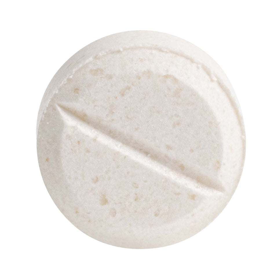 Close up shot of a single potassium iodide tablet